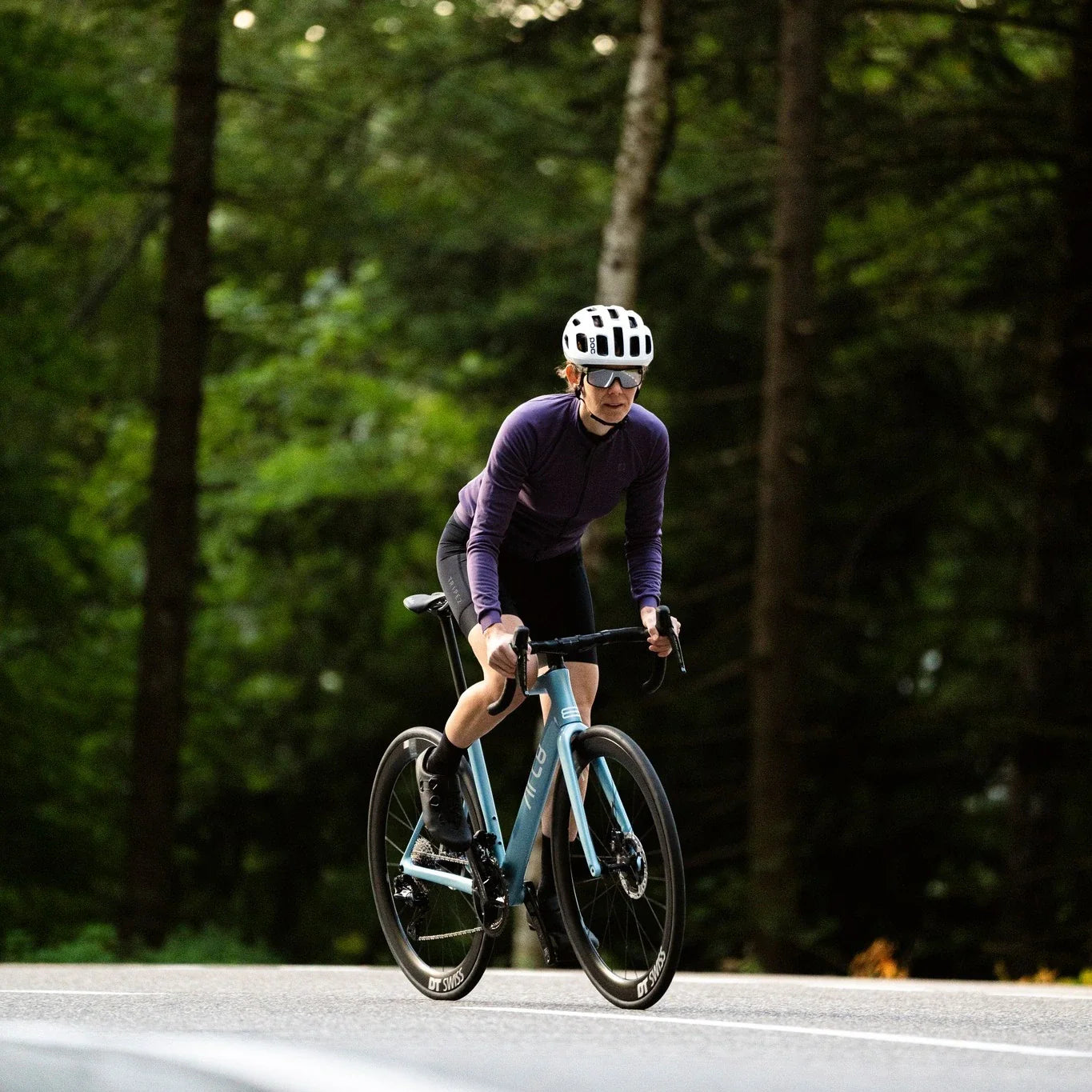 ARC8 Escapee being ridden on the road with the rider standing and pedaling