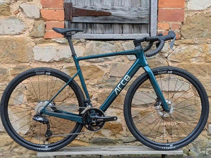 ARC8 Eero in Gloss Emerald Green Leaning against a wall